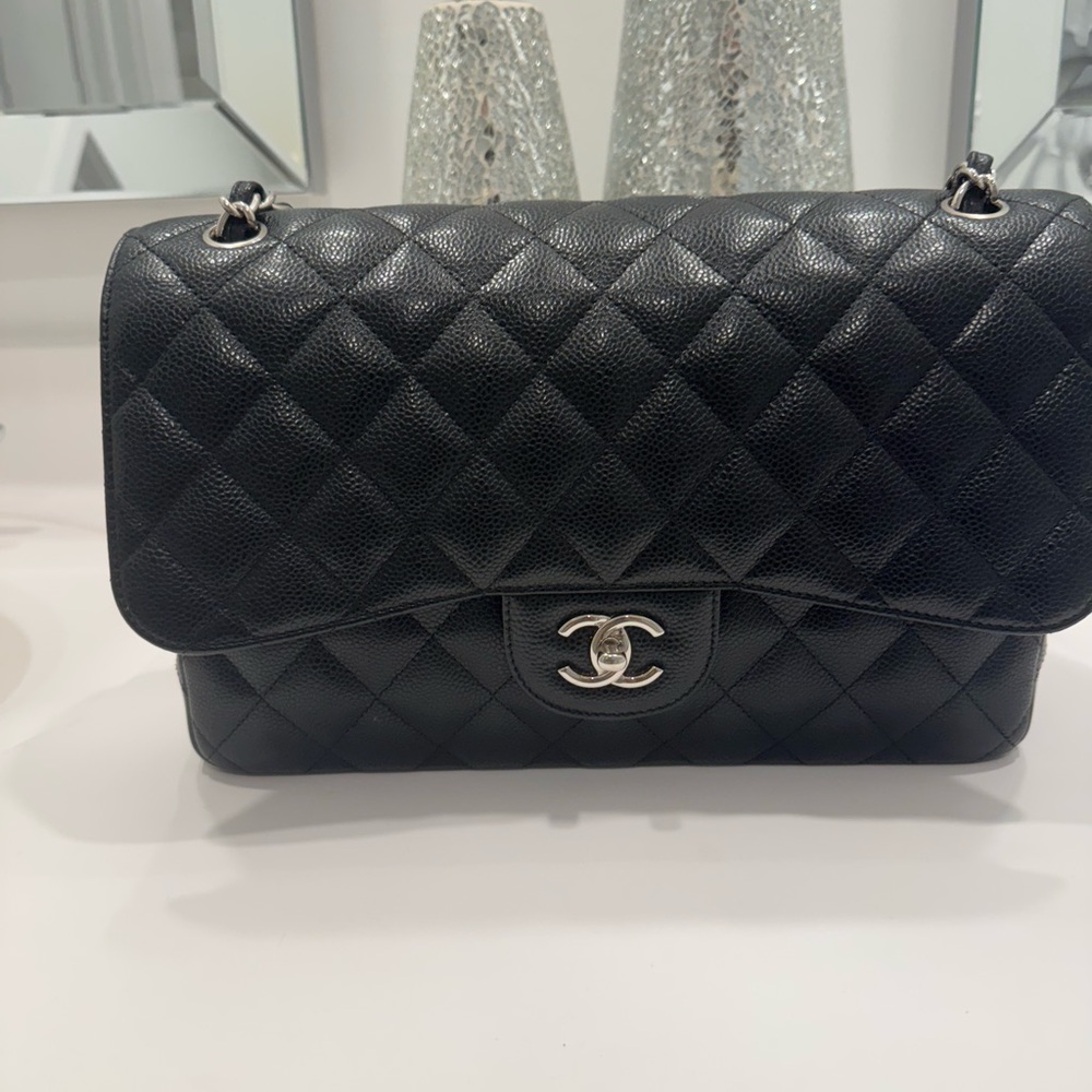 Chanel Black Quilted Shoulder Bag with Iconic CC Closure Silver hardware